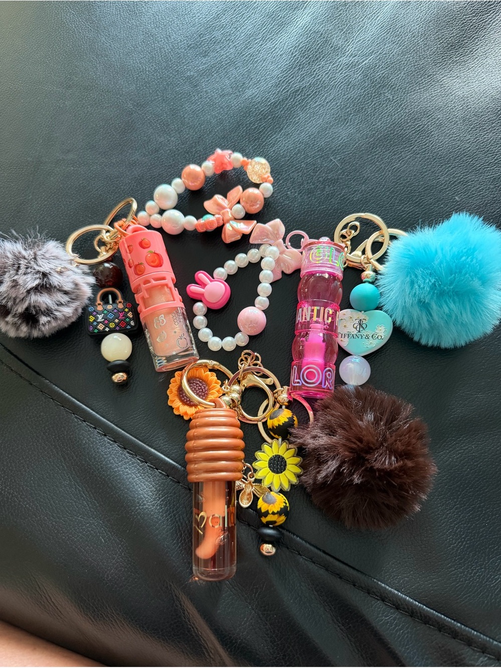 Cute Pink & multicolored Lip Gloss Keychain Set with Pom Poms!